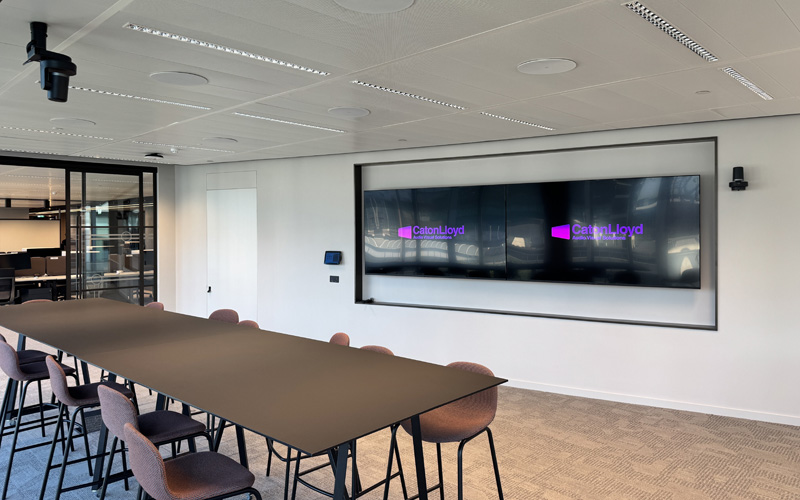 Two large display screens installed inside of collaboration room at CoStar Group's new London office.
