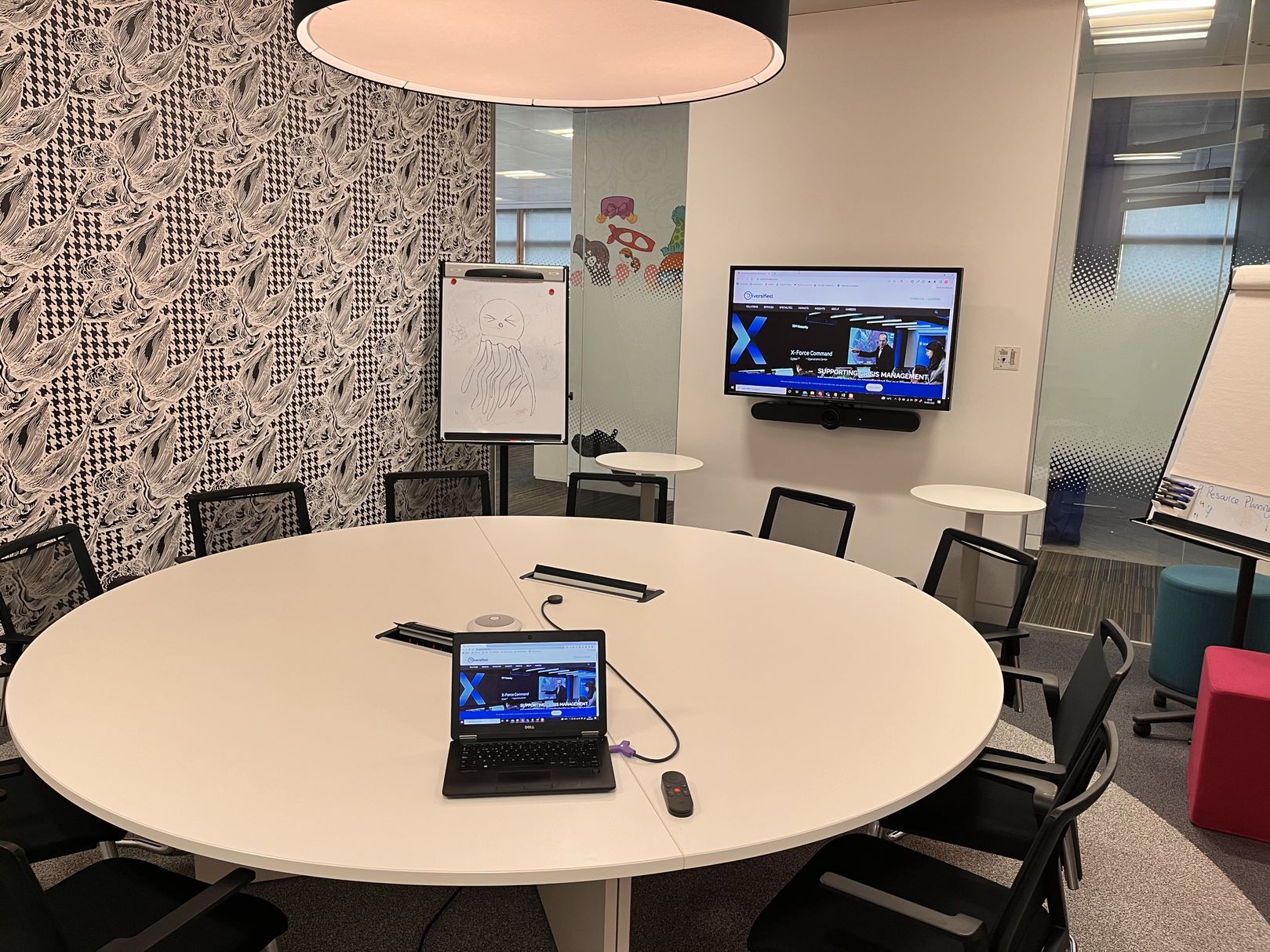 Full audio visual upgrade inside of London office, featuring large screen display and soundbar.