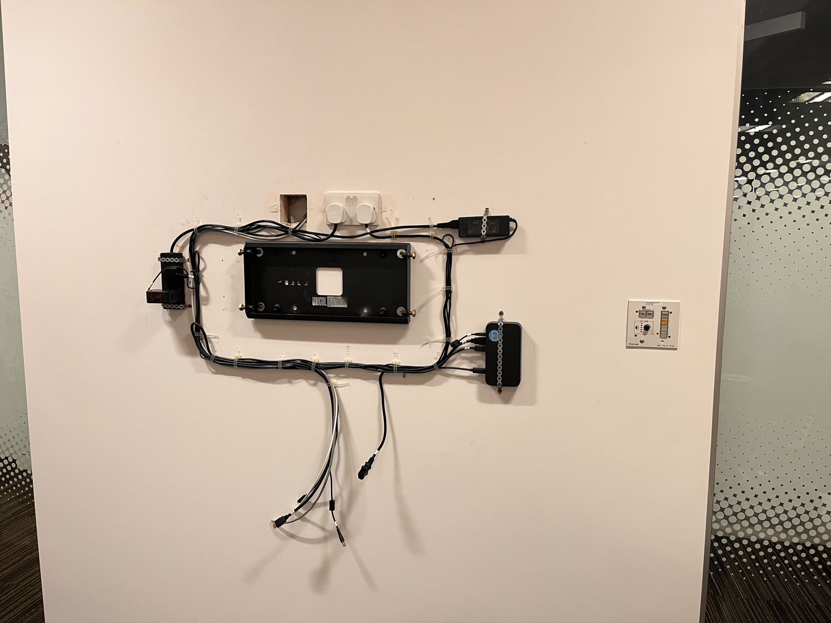 Display bracket installed inside of meeting room by CatonLloyd.