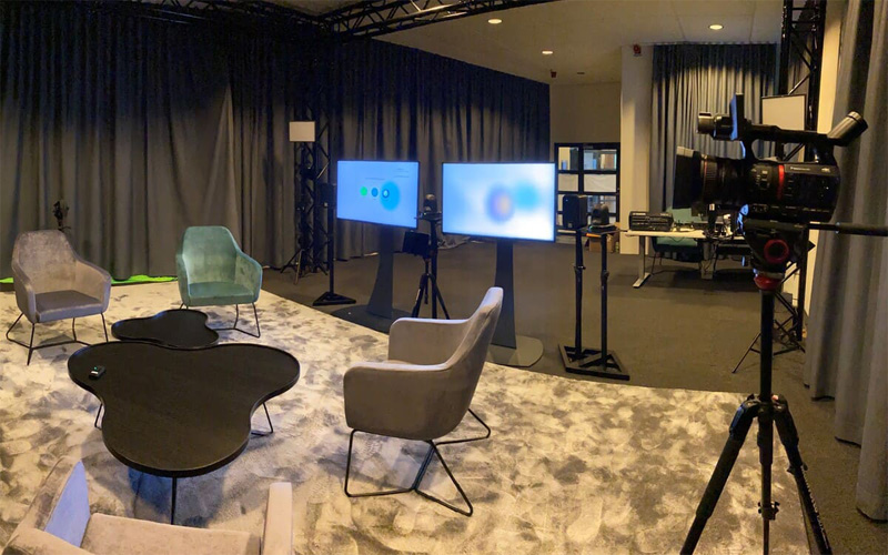 Stand mounted large format interactive screens, cameras, microphones and bespoke lighting inside of training suite.